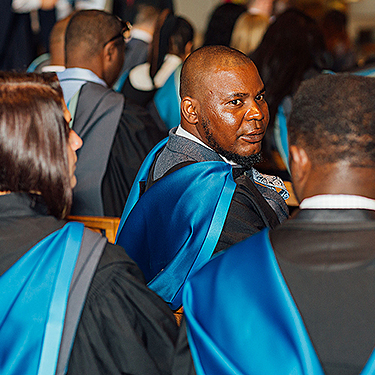 Arden University graduates in their gowns