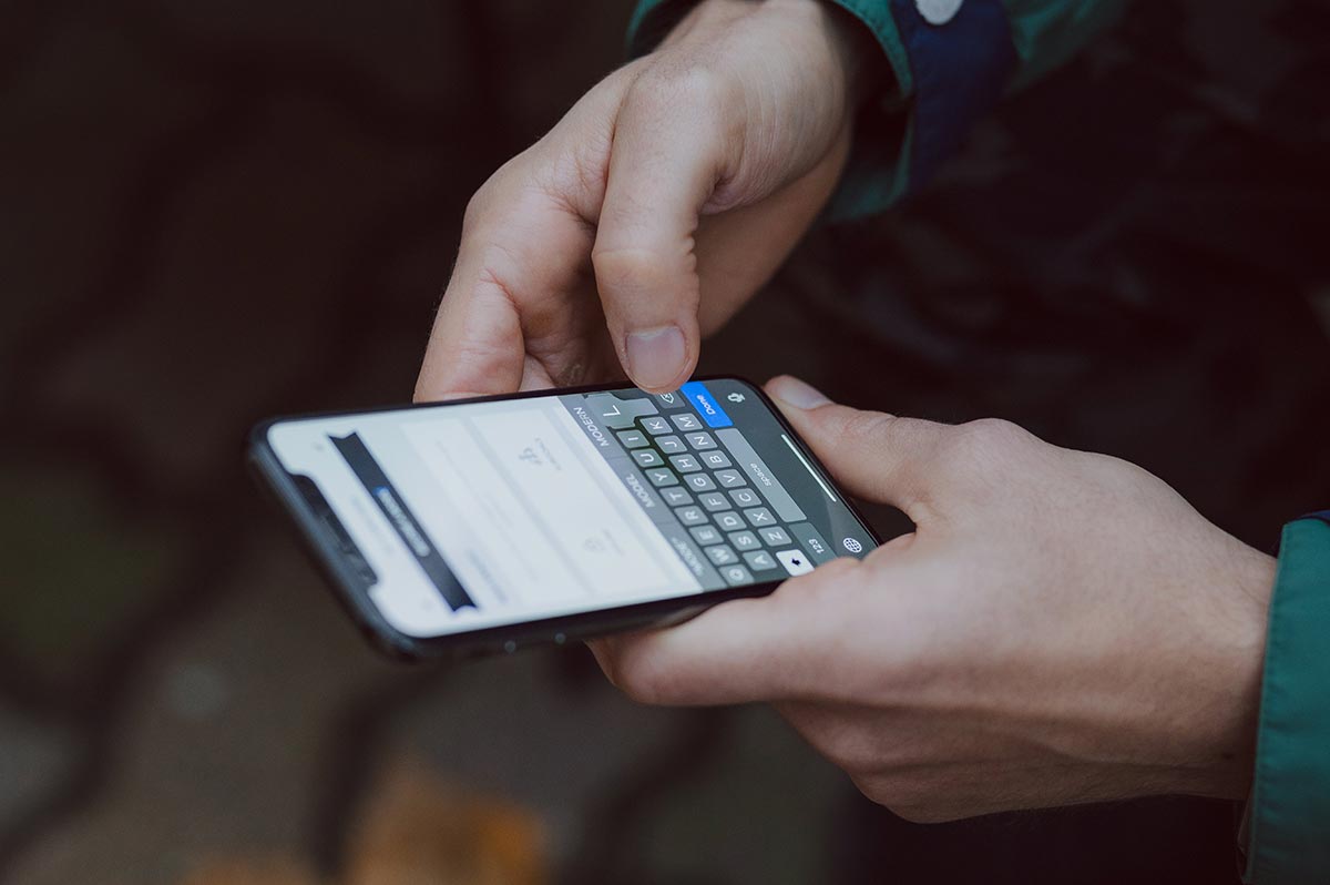 Hands holding smartphone