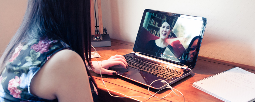 Woman studying a top-up degree course online