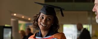 Woman graduating with a top-up degree course
